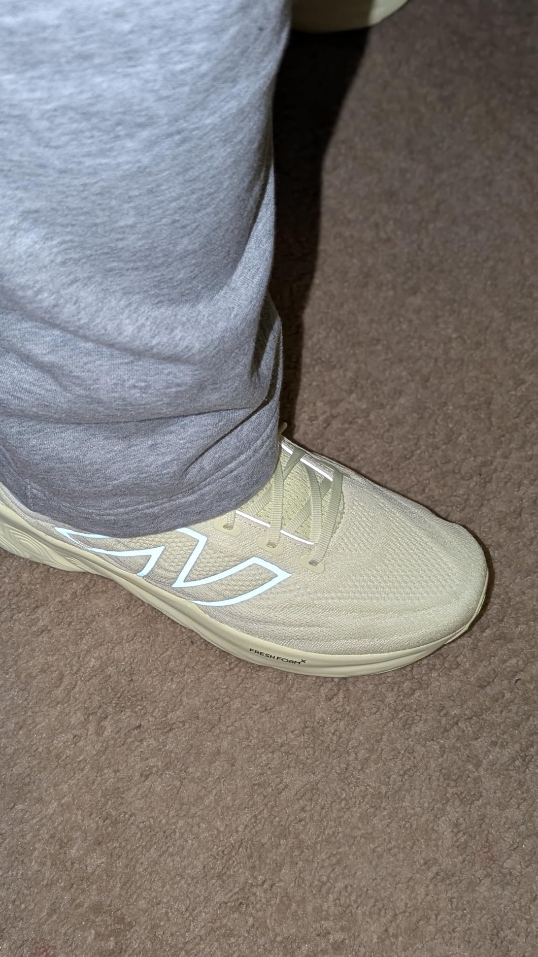 New Balance 1080 V13 detailed view showing engineered mesh upper construction and lacing system