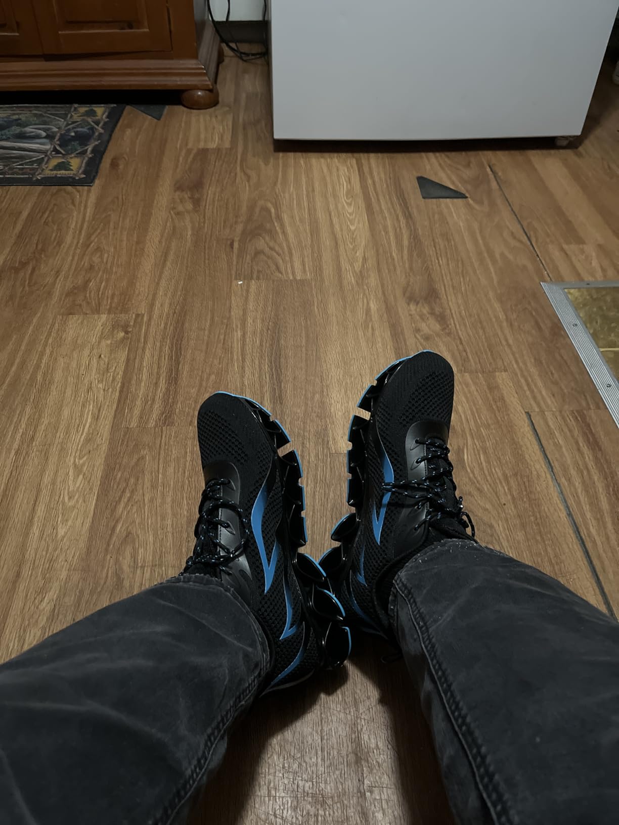 Close-up view of mens blade sneakers showing knit mesh upper and slip-on design details