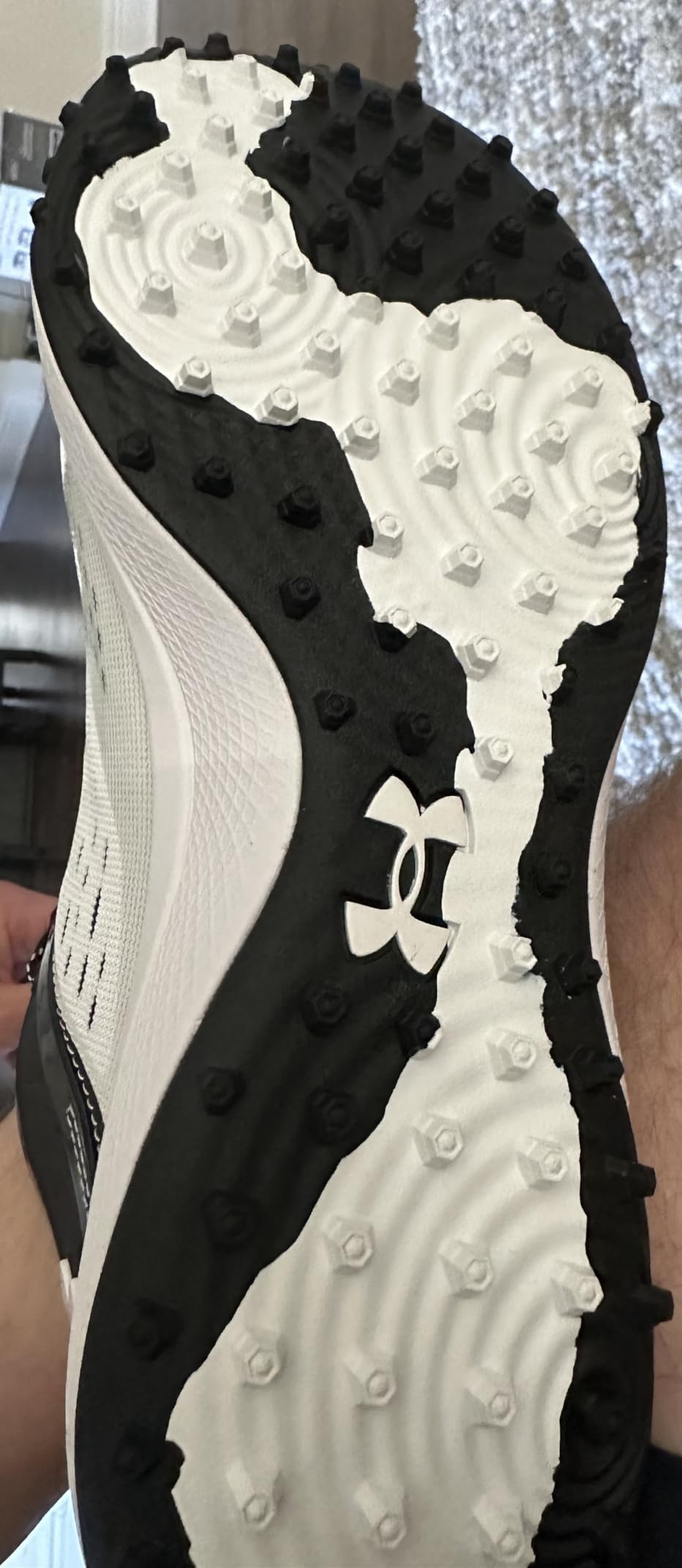 Under Armour Yard Low outsole showing rubber turf pattern and lug configuration