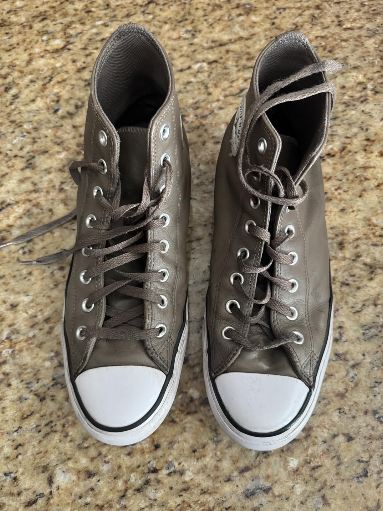 Family of cleaned sneakers showing before and after results from SneakERASERS testing