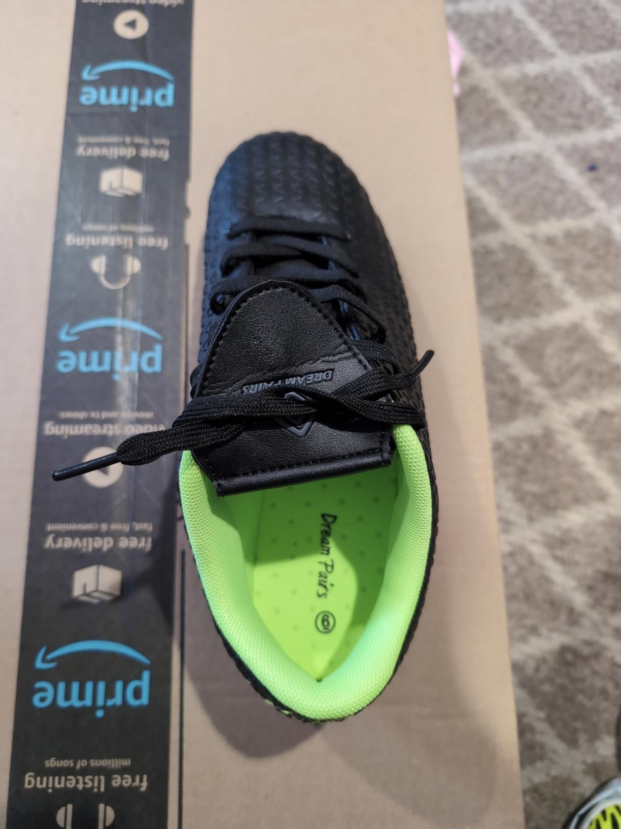 DREAM PAIRS soccer cleats showing detailed upper construction faux leather material and lacing system