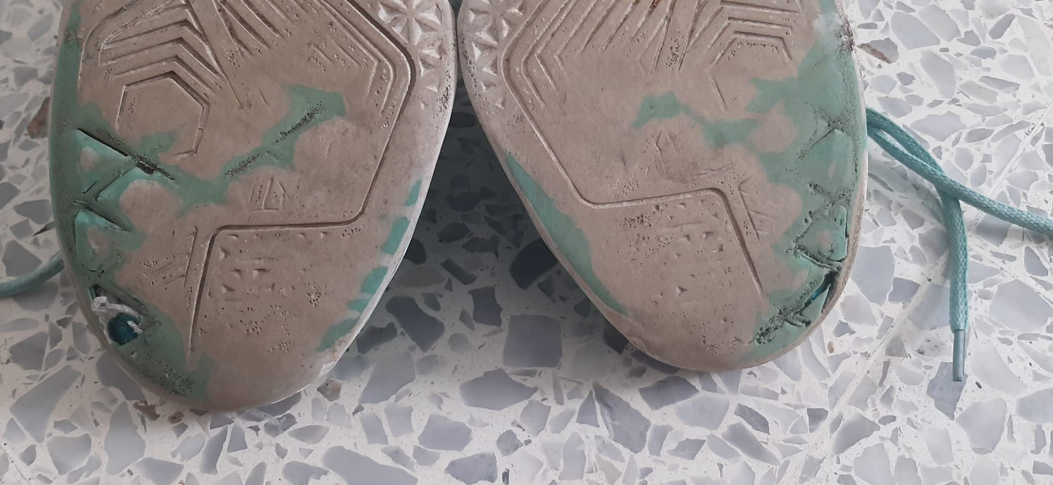 Close-up view of mesh upper construction and PU reinforcement details on high top basketball sneakers