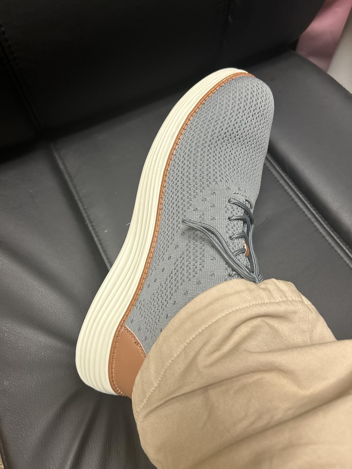Close-up view of VILOCY sneakers showing knit mesh breathable upper construction and lace detail