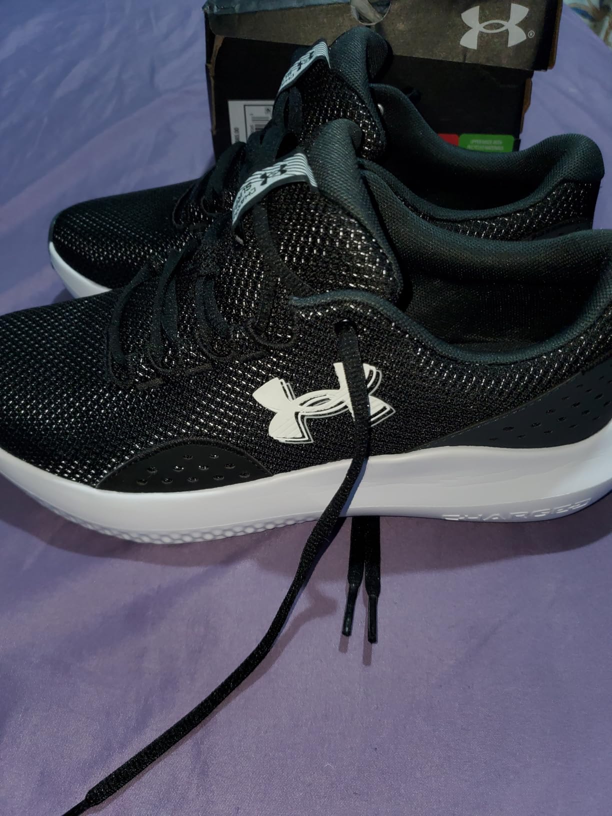 Under Armour Charged Surge 4 being tested in gym environment showing versatility across different surfaces