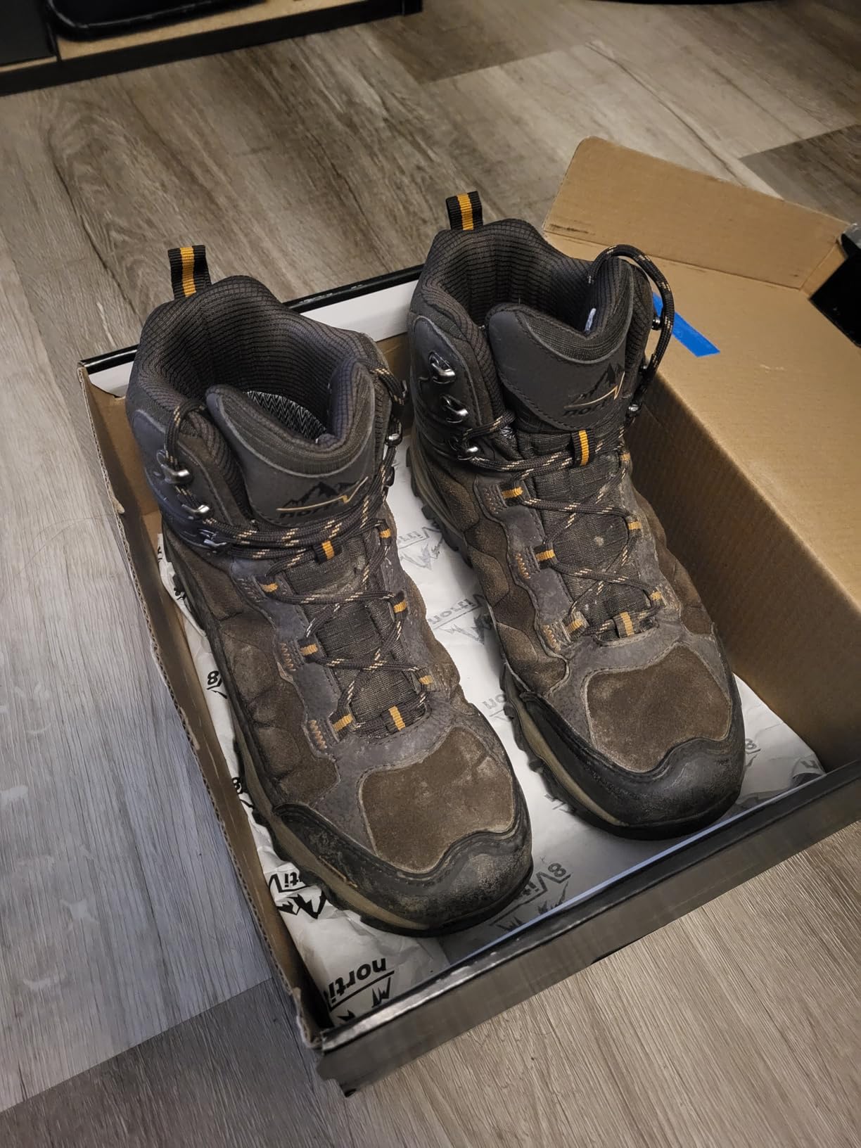 NORTIV 8 boots in action during real hiking conditions showing traction performance