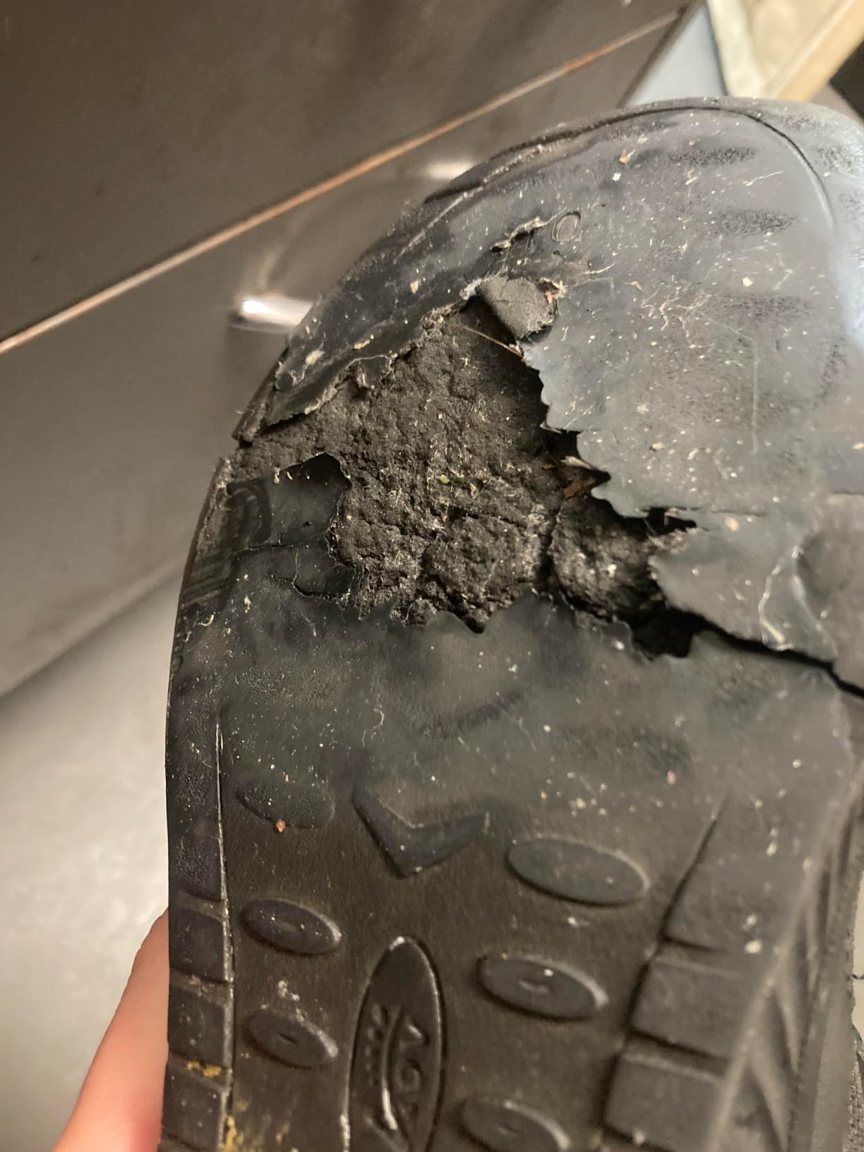 Close-up of AOV shoe construction showing wear patterns after extended use