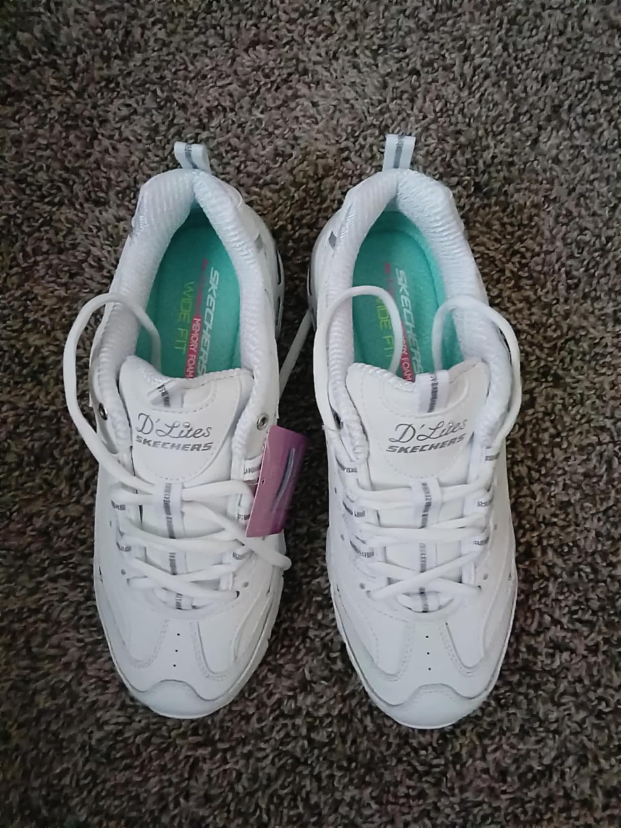 Close-up of Skechers D'Lites upper construction showing leather texture and lacing system