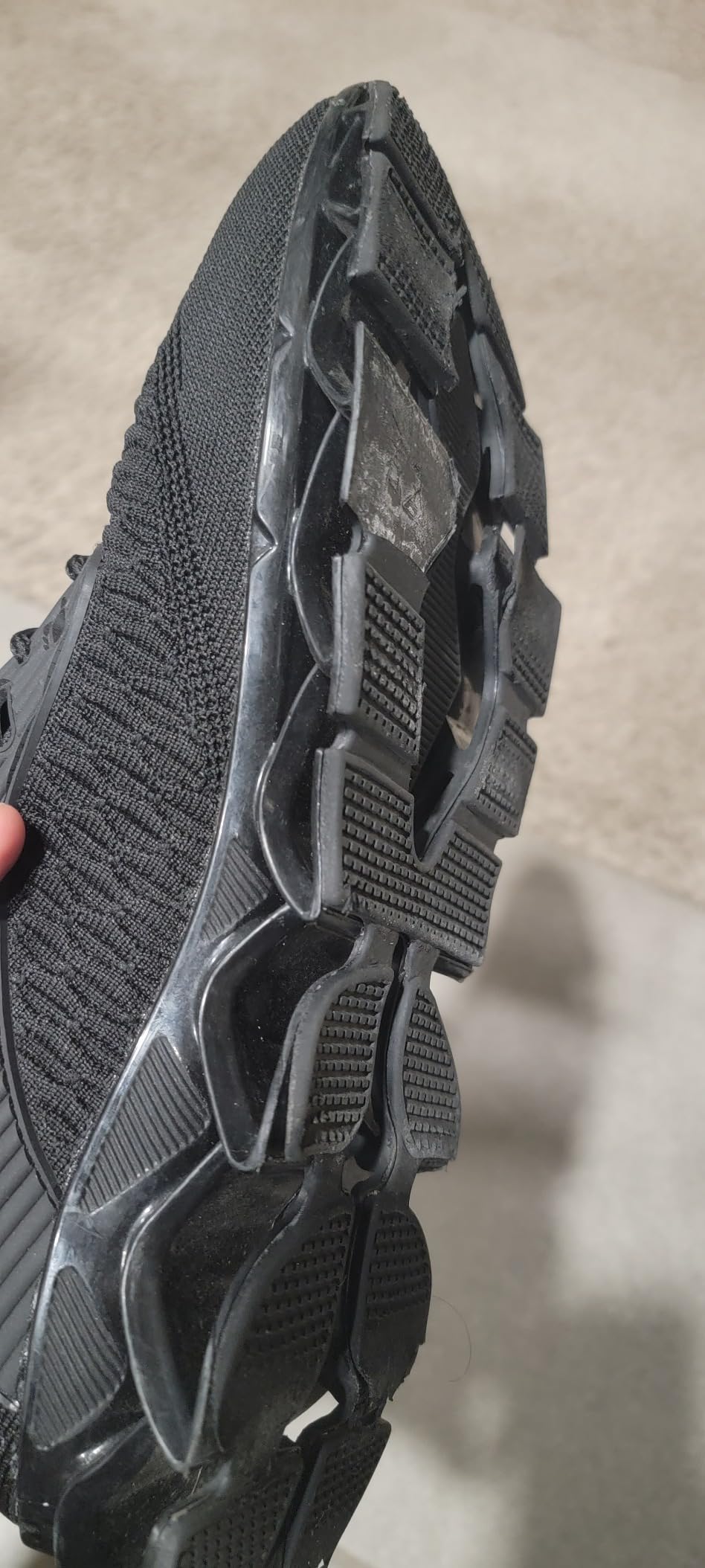 Men's Running Shoes detailed upper construction showing knitted fabric and pull-on design