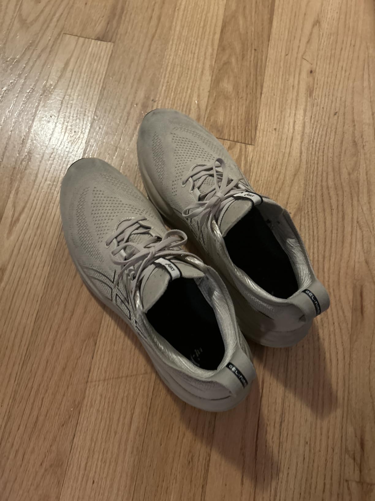 ASICS Men's Gel-Nimbus 26 running shoes showing engineered knit upper and PureGEL cushioning technology