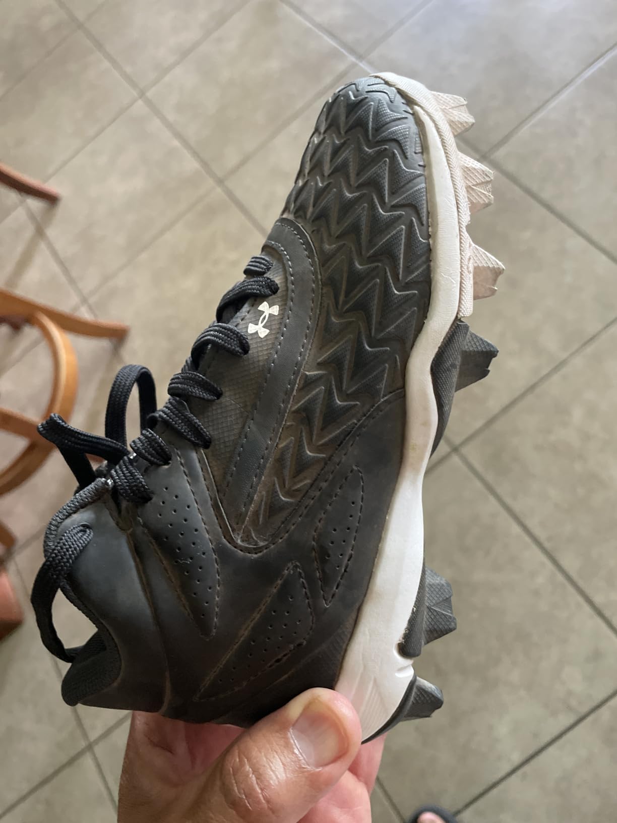Under Armour Leadoff Mid baseball cleats showing synthetic upper construction and lace-up closure system