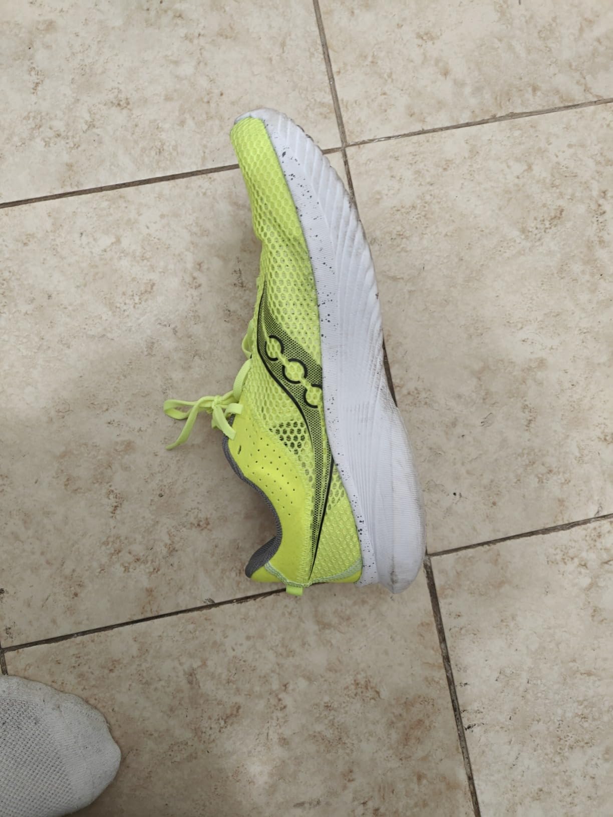 Saucony Kinvara 14 heel counter and ankle collar design showing secure fit features