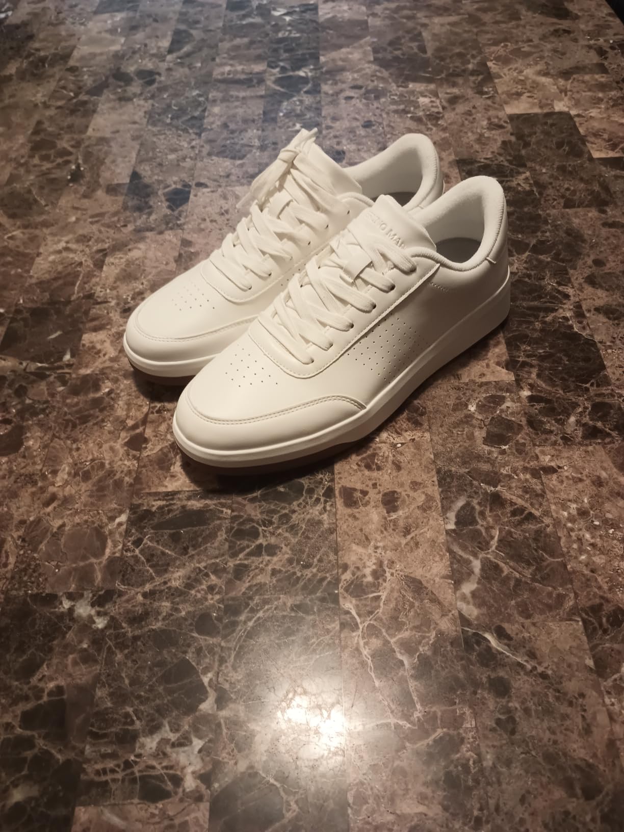 Bruno Marc sneakers on feet showing how they look with casual jeans and their clean profile