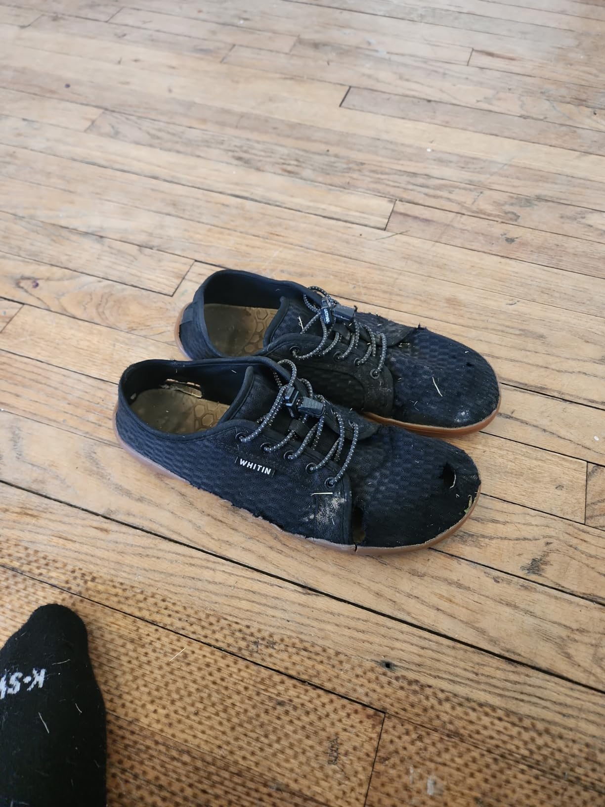 WHITIN amphibious shoes worn during outdoor water activity showing practical use case