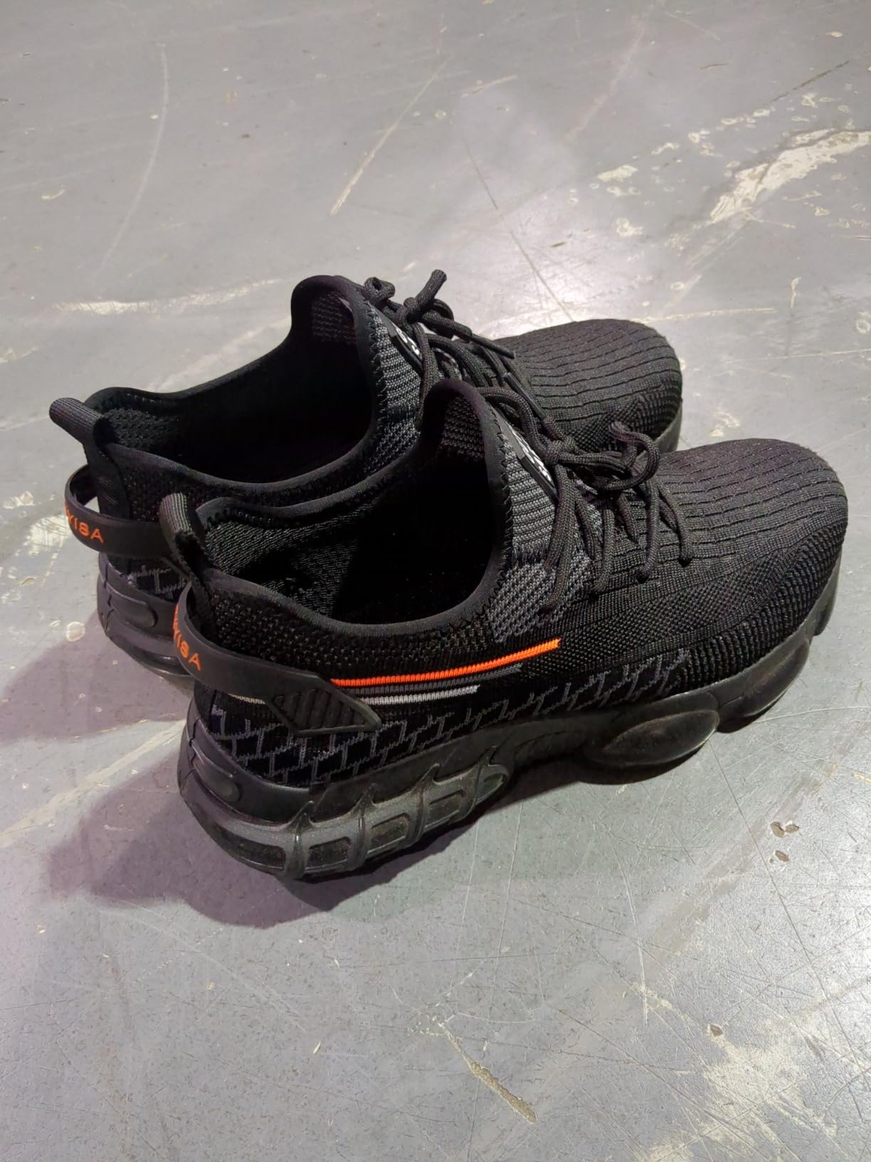 Steel toe work shoes showing breathable mesh upper and steel toe protection detail