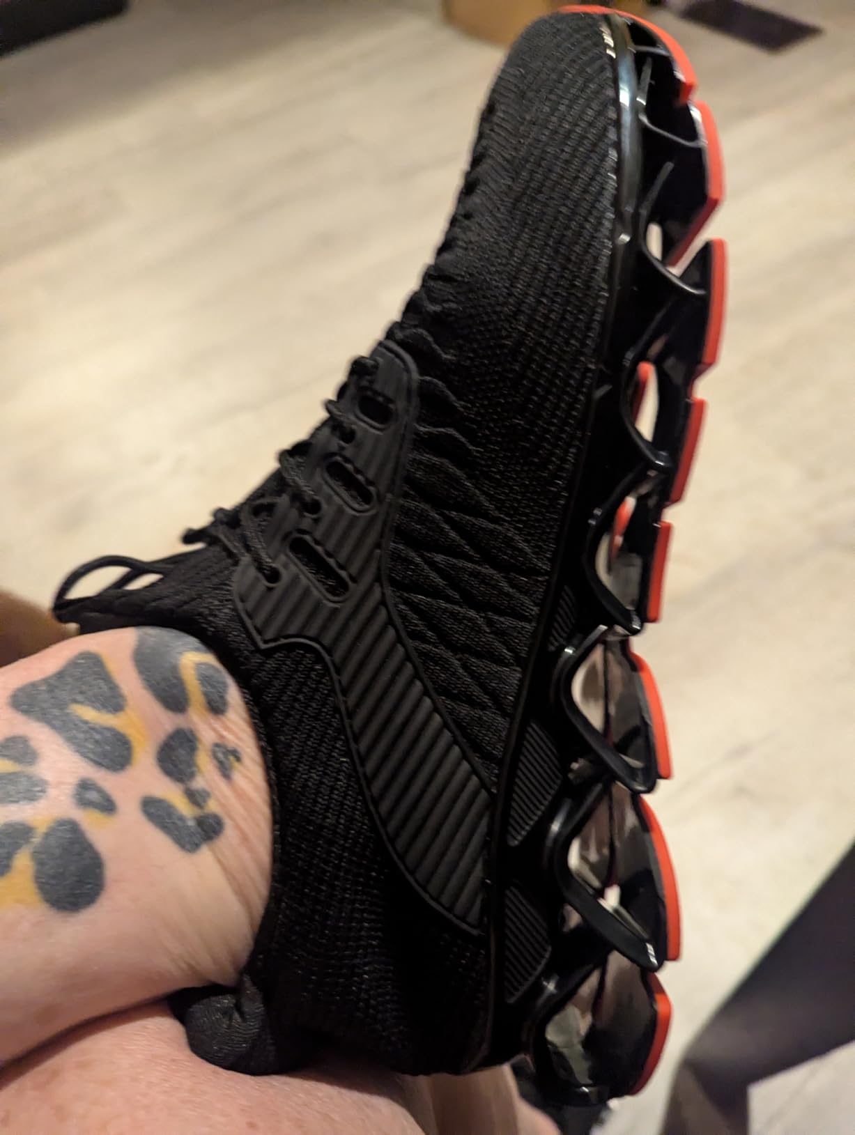 Women's blade sneakers product shot showing the advertised features and design elements