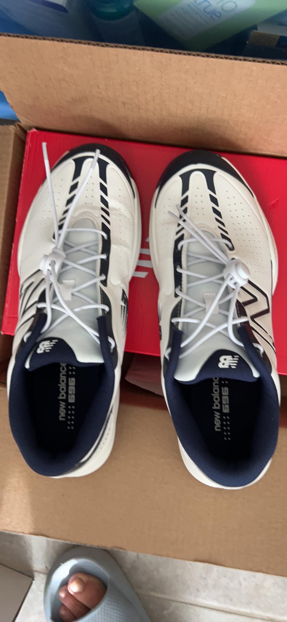 New Balance 696 V5 side profile showing lateral support structure and court-specific design elements