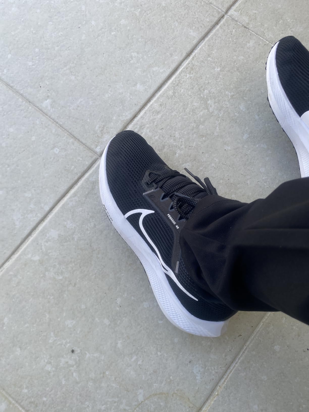 Nike Pegasus 37 upper mesh construction detail showing engineered single-layer material and lacing system