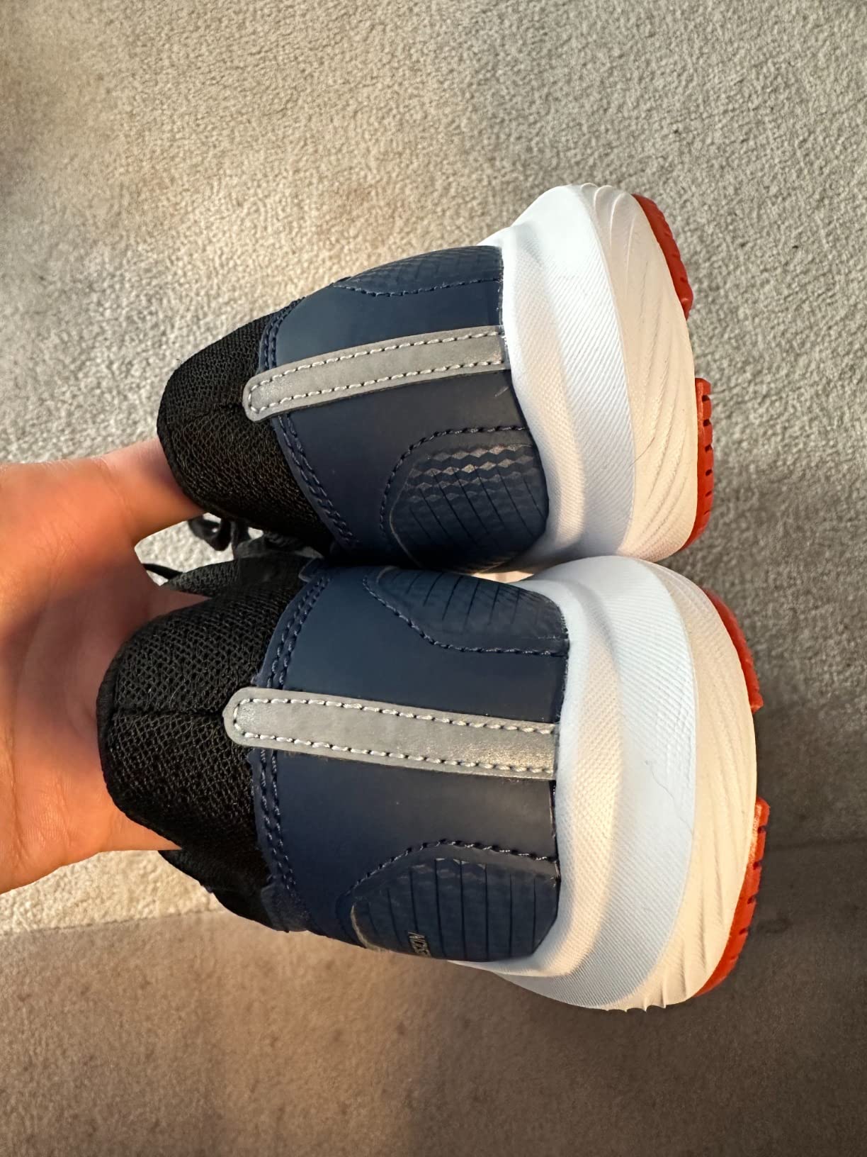 Close-up view of Saucony Cohesion 16 mesh upper construction showing lacing system and breathable material