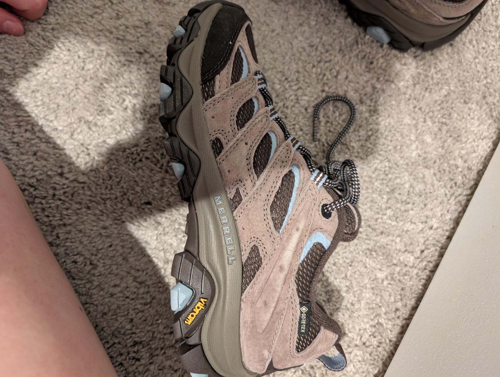 Merrell Moab 3 low-cut design showing ankle height and lacing system