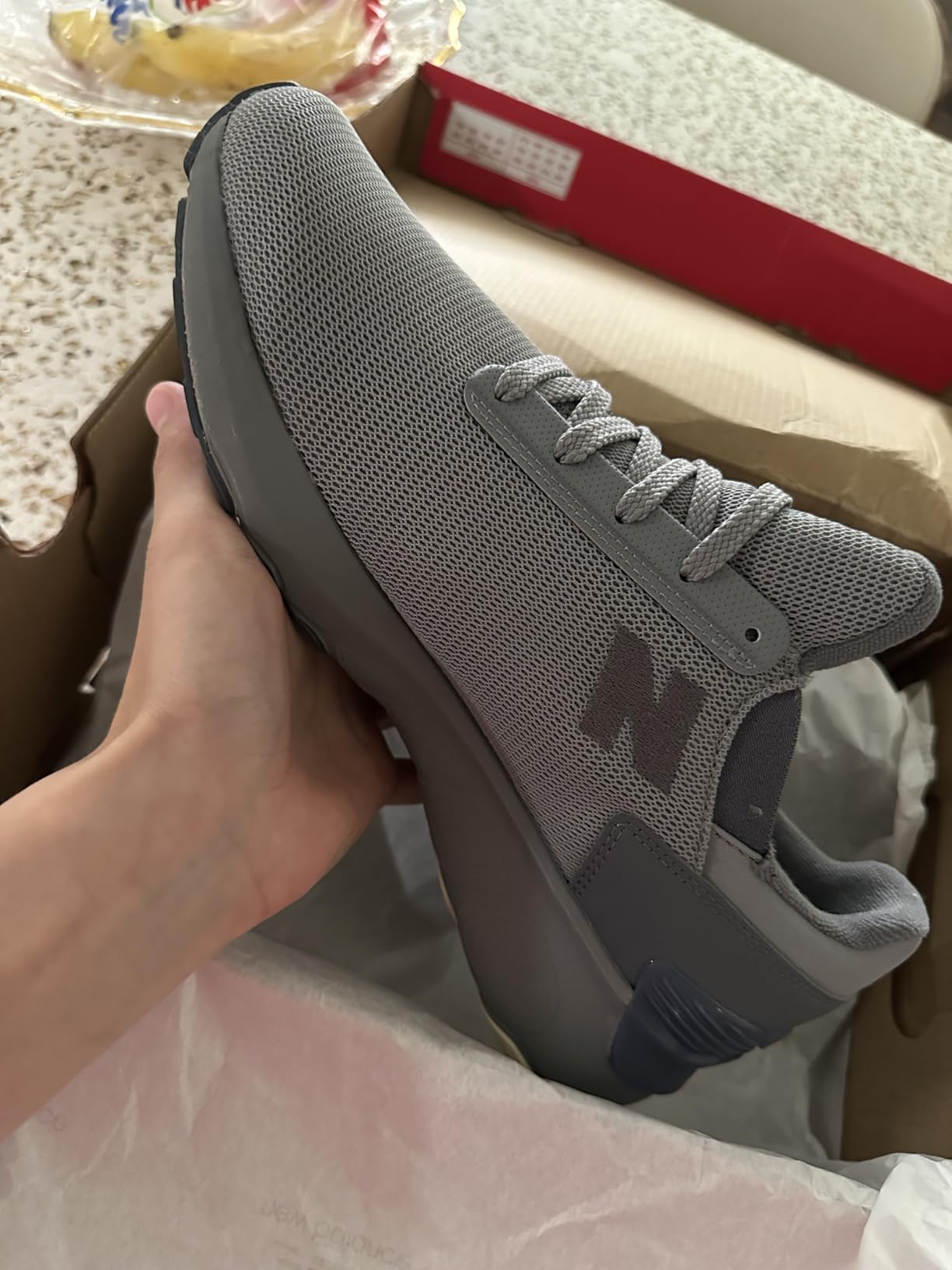 New Balance 1440 v1 side profile showing knit mesh upper construction and TPU heel clip design