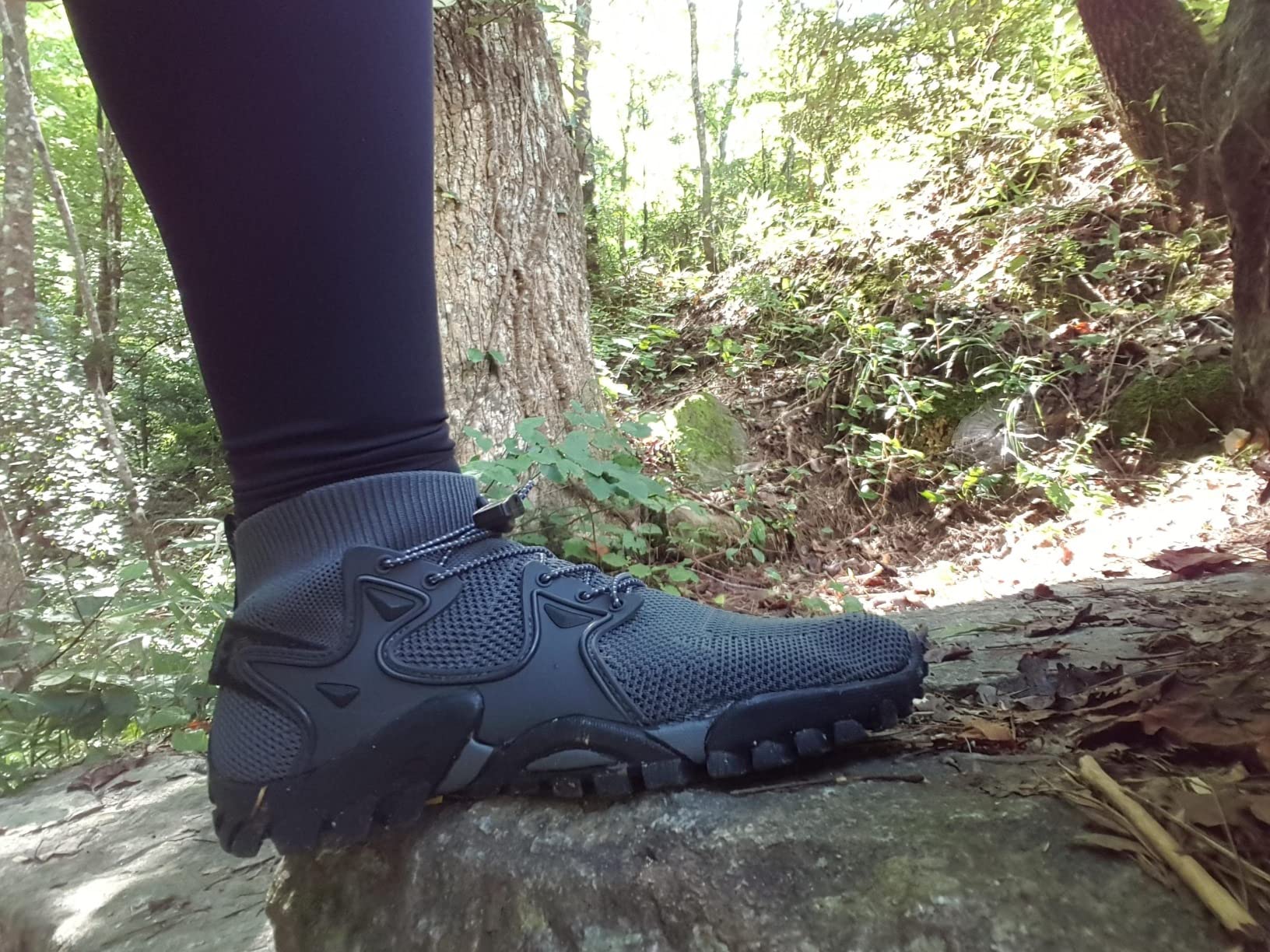 Side view of hiking shoes showing ankle protection and sole construction