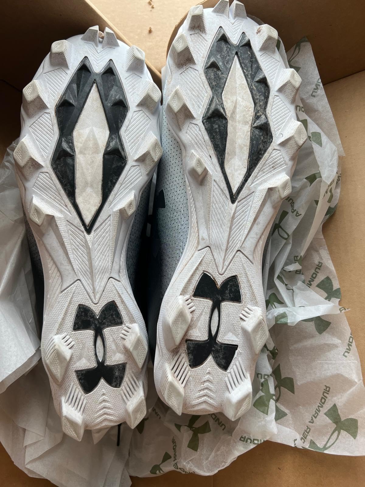 Under Armour football cleats being worn during practice showing field performance and traction