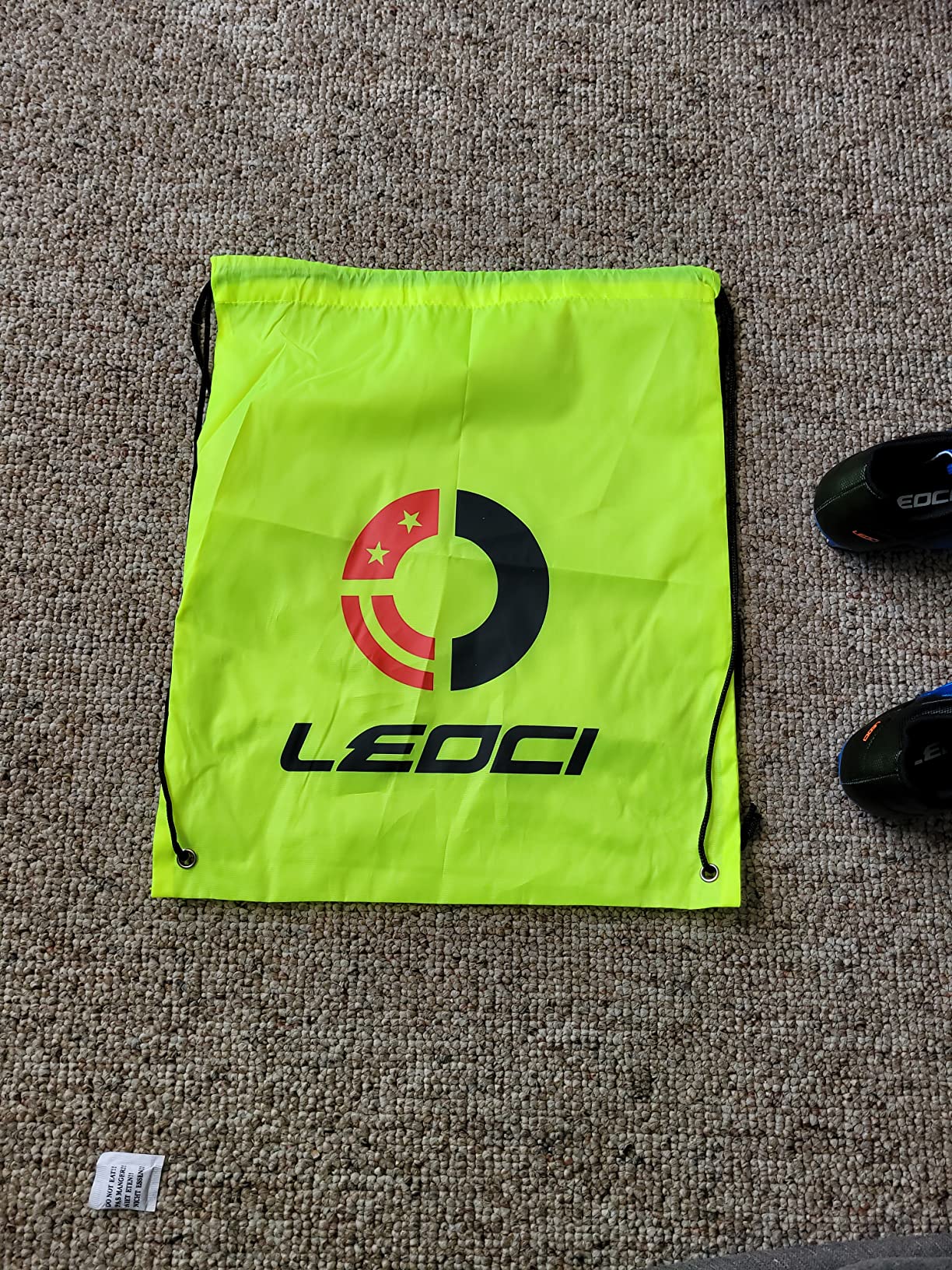 LEOCI kids soccer cleats showing bright green colorway with breathable design and AG/FG sole pattern