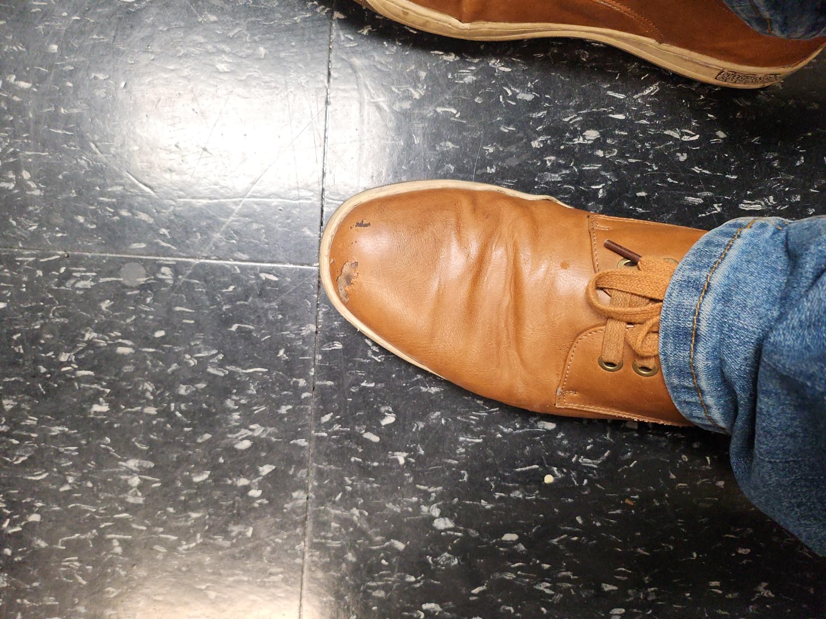 Jousen dress sneaker showing early signs of wear and sole separation after regular use