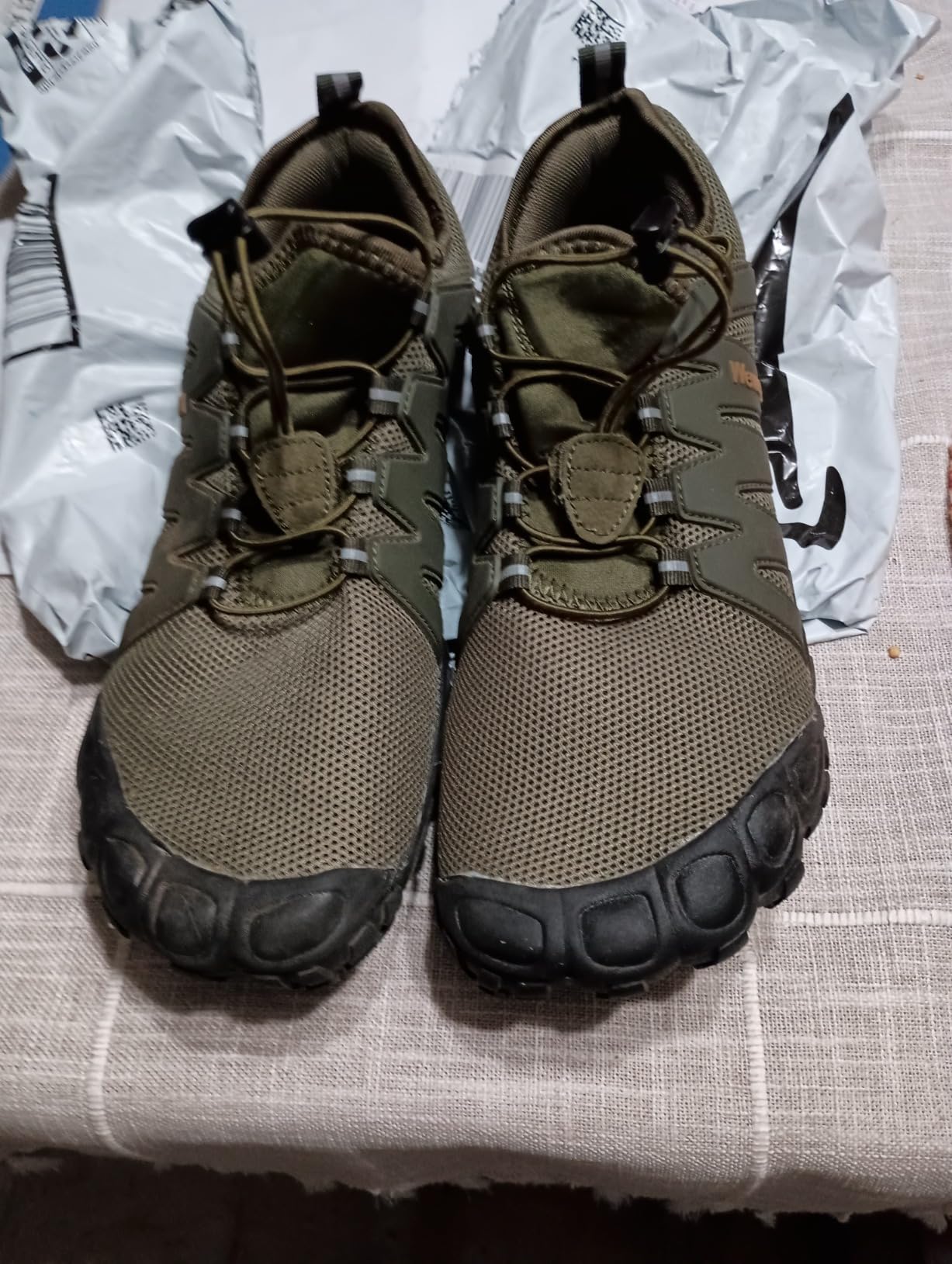 Close-up view of Weweya barefoot shoes showing mesh upper construction and lacing system