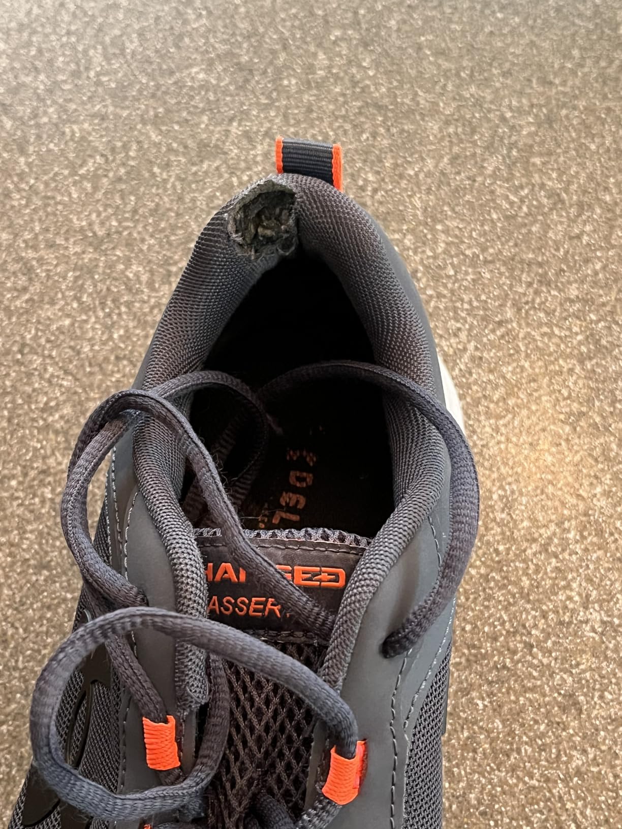Under Armour Charged Assert 9 outsole pattern showing high-impact zone coverage and traction design