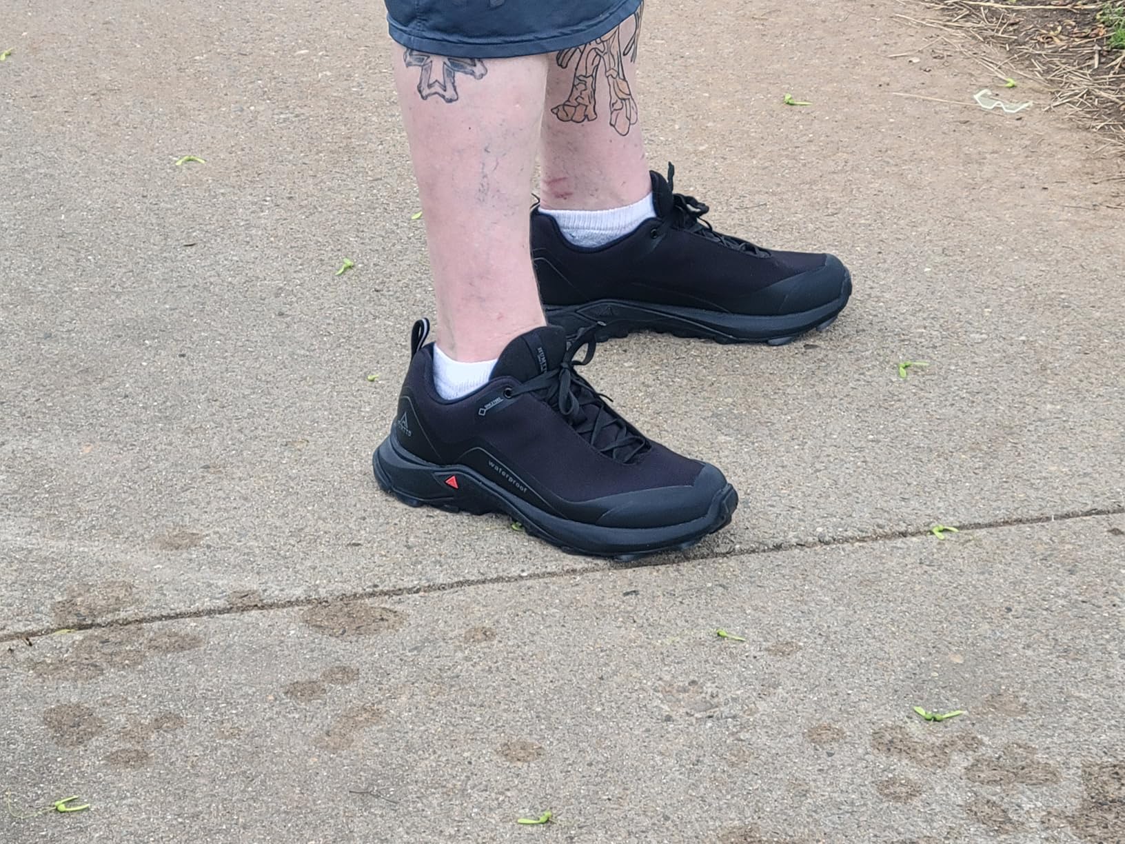 HUMTTO hiking shoes being tested in wet conditions demonstrating waterproof capabilities