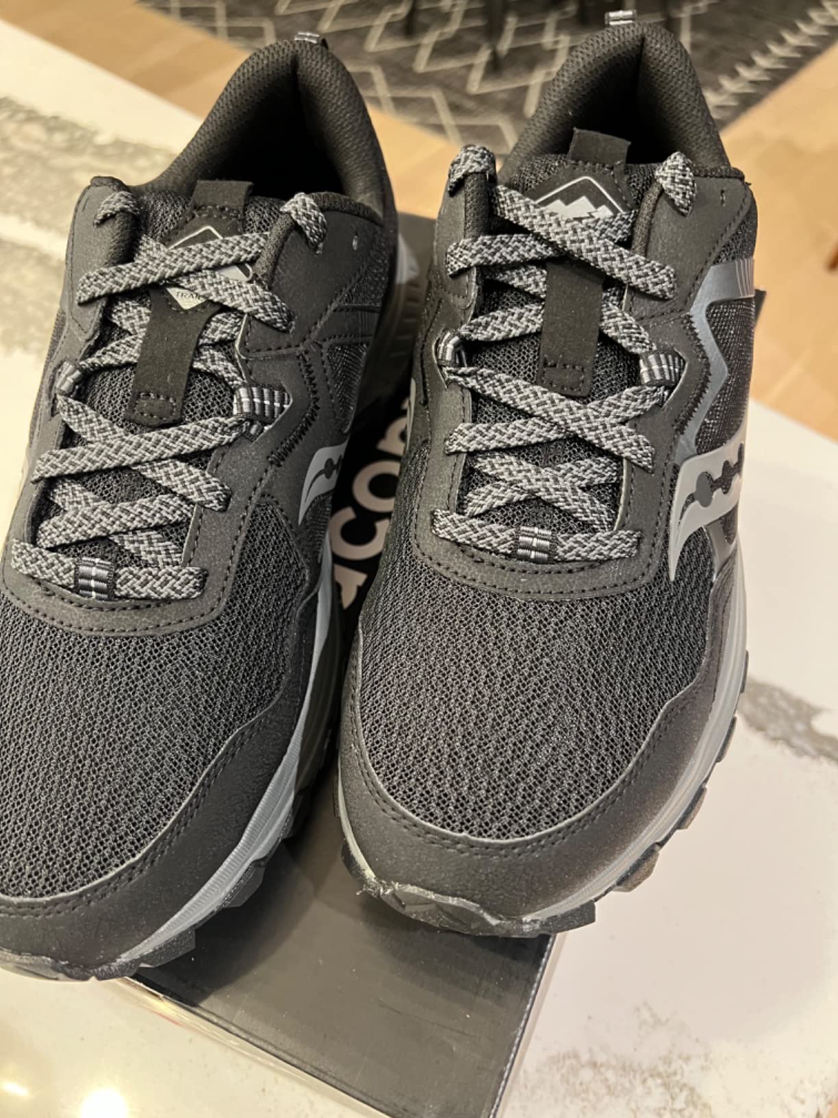 Saucony TR16 outsole showing carbon rubber lugs and traction pattern for multiple terrain types
