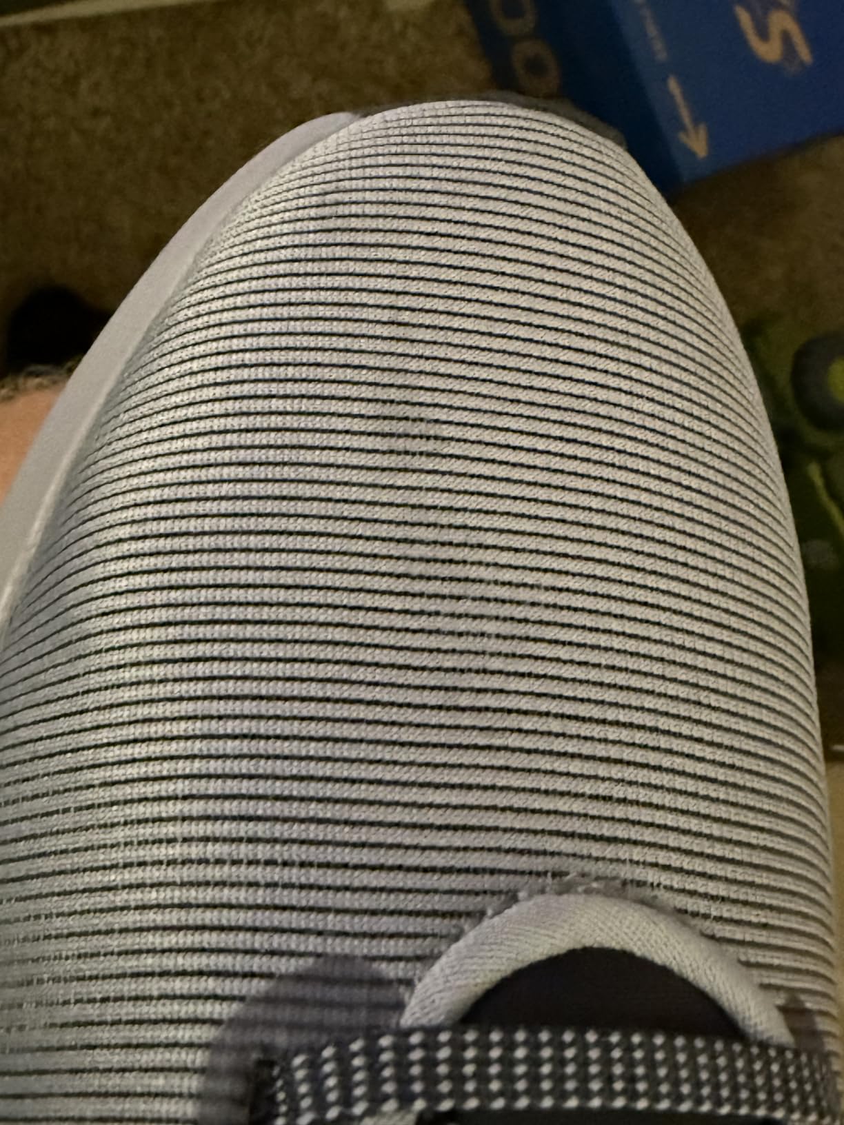 Nike Downshifter 12 midsole detail showing foam construction and heel cushioning design