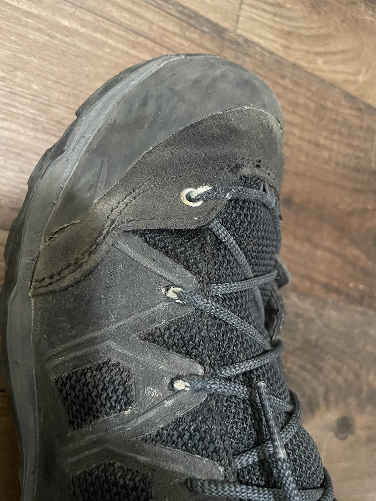Salewa hiking boots detail showing TPU-coated fabric upper and climbing lacing system