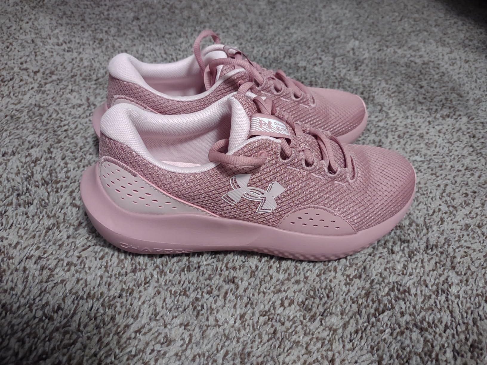 Under Armour Charged Surge 4 lifestyle shot showing versatility for gym and casual wear activities