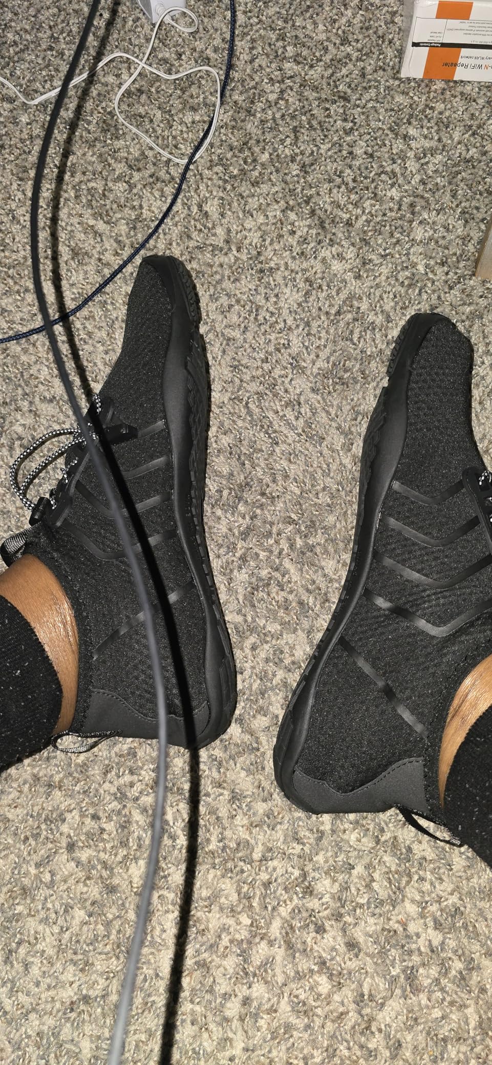 Racqua water shoes in action showing drainage holes and flexible sole design