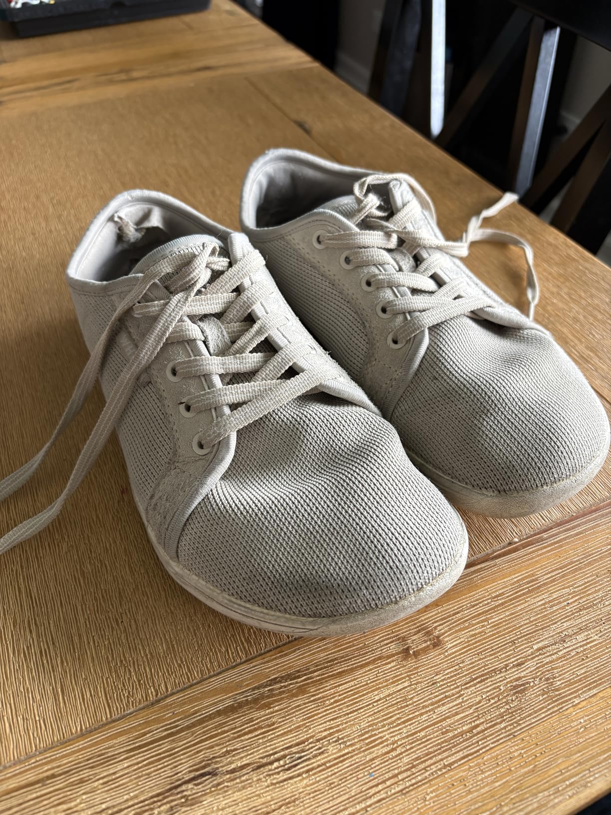 Worn WHITIN barefoot shoes after one year showing durability and sole wear patterns