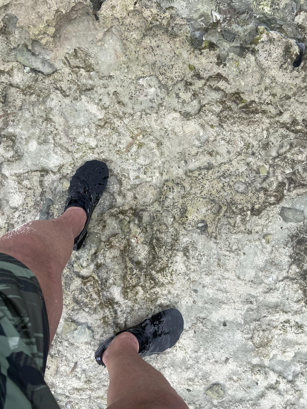 Water shoes on rocky beach showing practical use and traction performance