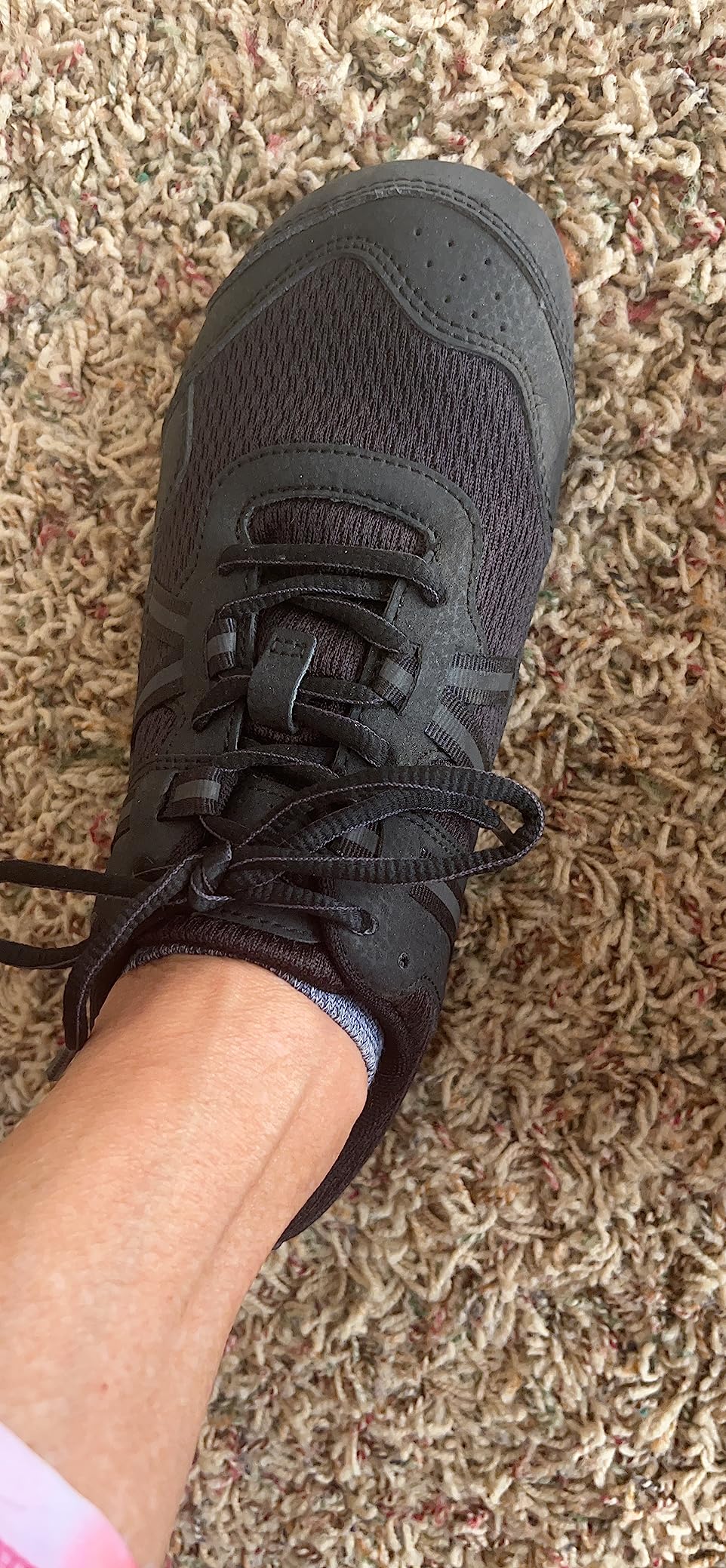 Xero Shoes Women's Prio barefoot athletic sneakers showing wide toe box design and black/white colorway