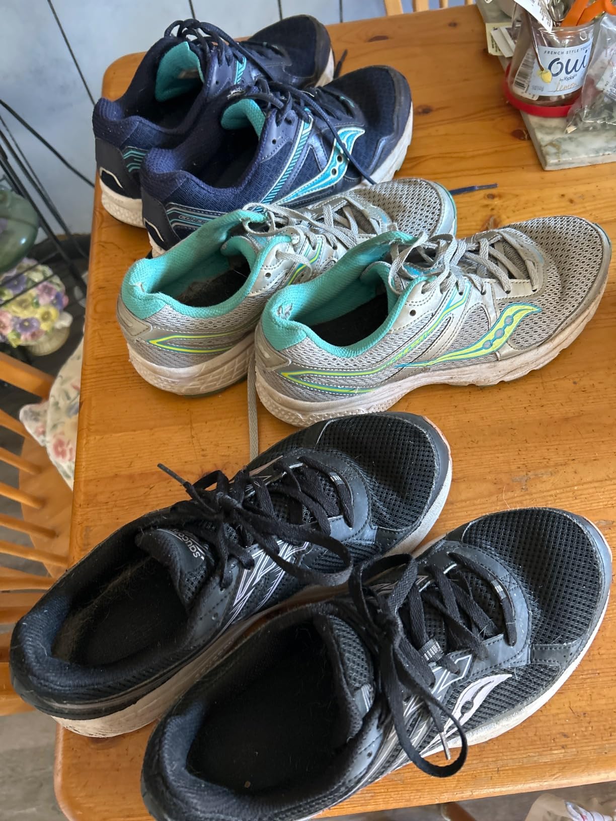 Side profile view of Saucony Cohesion 15 showing heel counter design and overall silhouette for running