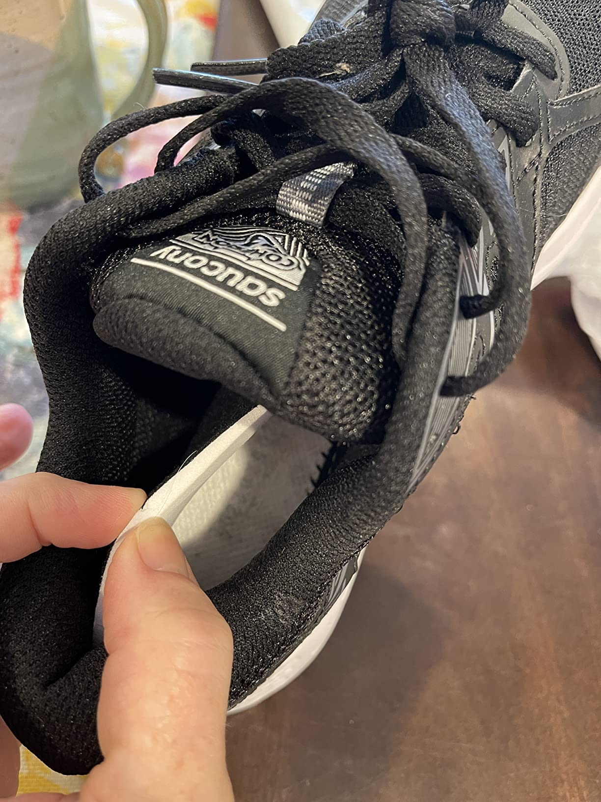 Close-up of Saucony Cohesion 13 insole showing VERSARUN cushioning technology and arch support design