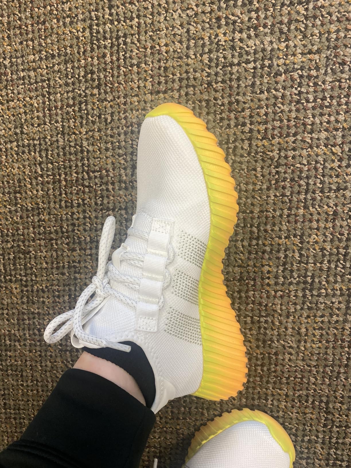 Adidas Kaptir Flow side profile showing Bounce midsole technology and rubber outsole