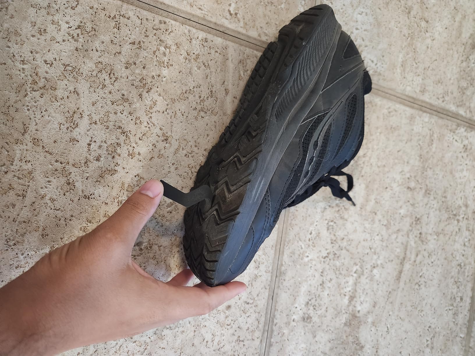 Saucony Cohesion 14 Trail detailed side view showing leather upper construction and VERSARUN midsole technology