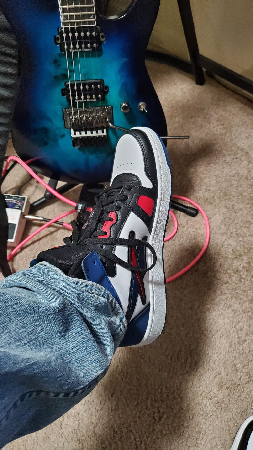 Close-up view of Reebok Resonator Mid showing leather upper construction and lacing system