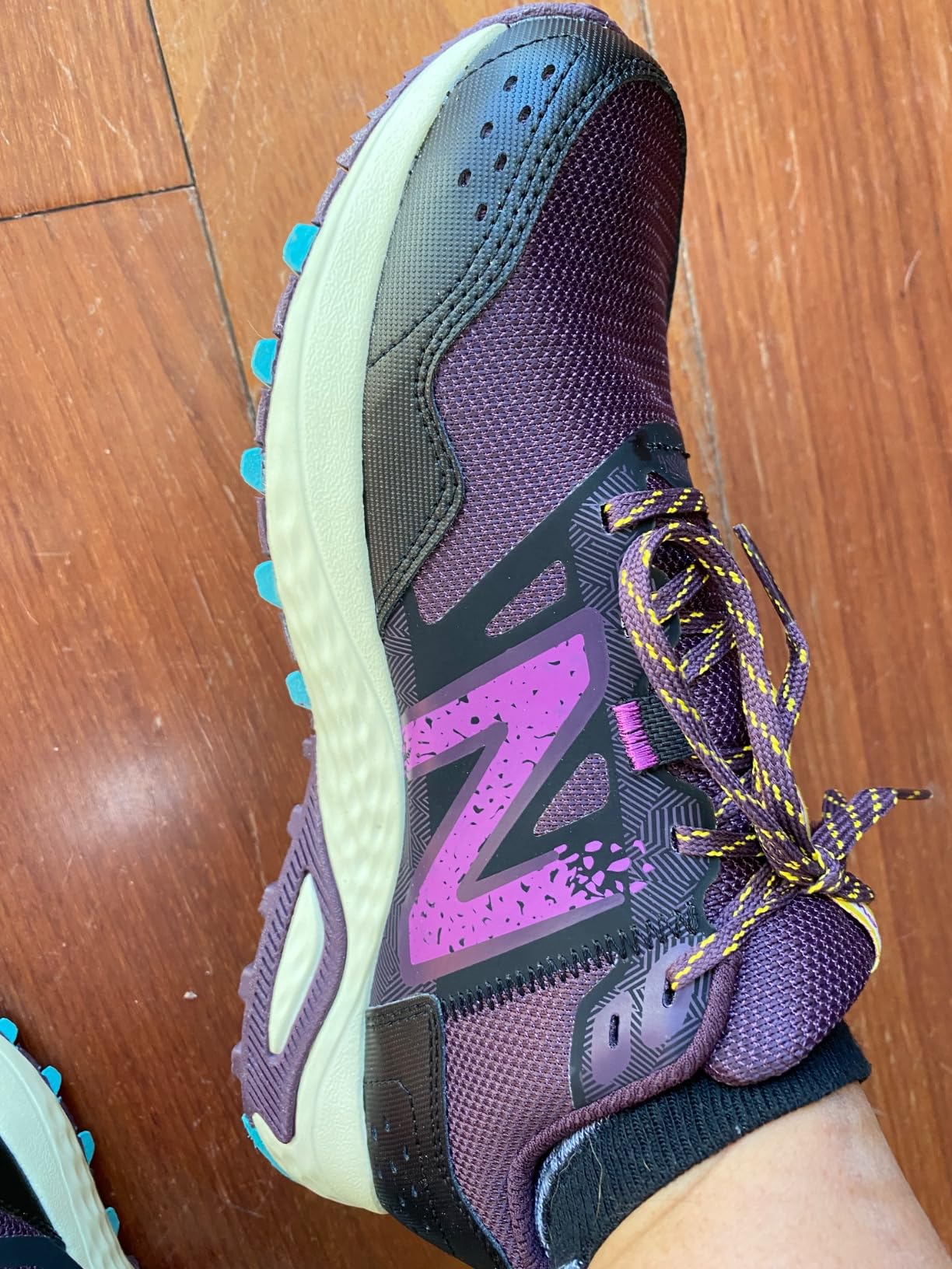 New Balance 410 V8 trail shoe showing versatile styling suitable for various activities