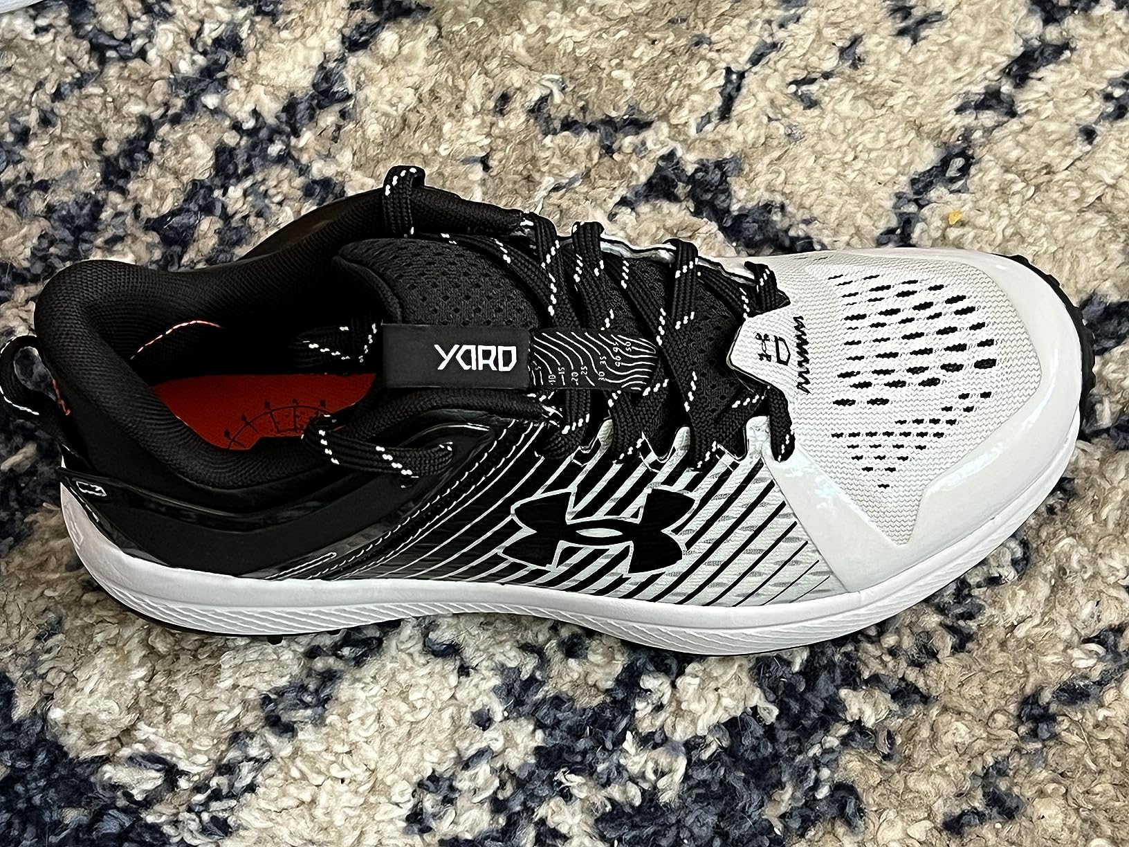 Under Armour Yard Low cleats showing versatility across different field surfaces during testing