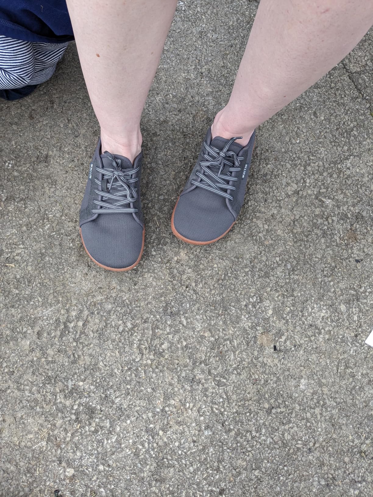 WHITIN barefoot shoes detail shot showing knitted upper construction and wide toe box from side angle