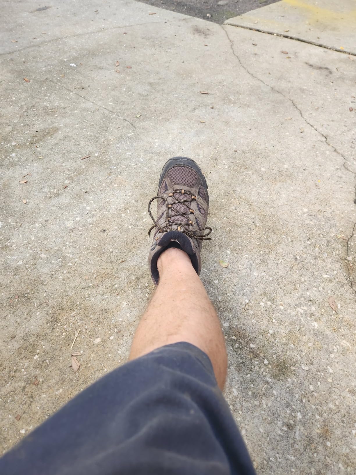 Merrell Moab 3 boots in action during power washing showing waterproof performance in wet conditions