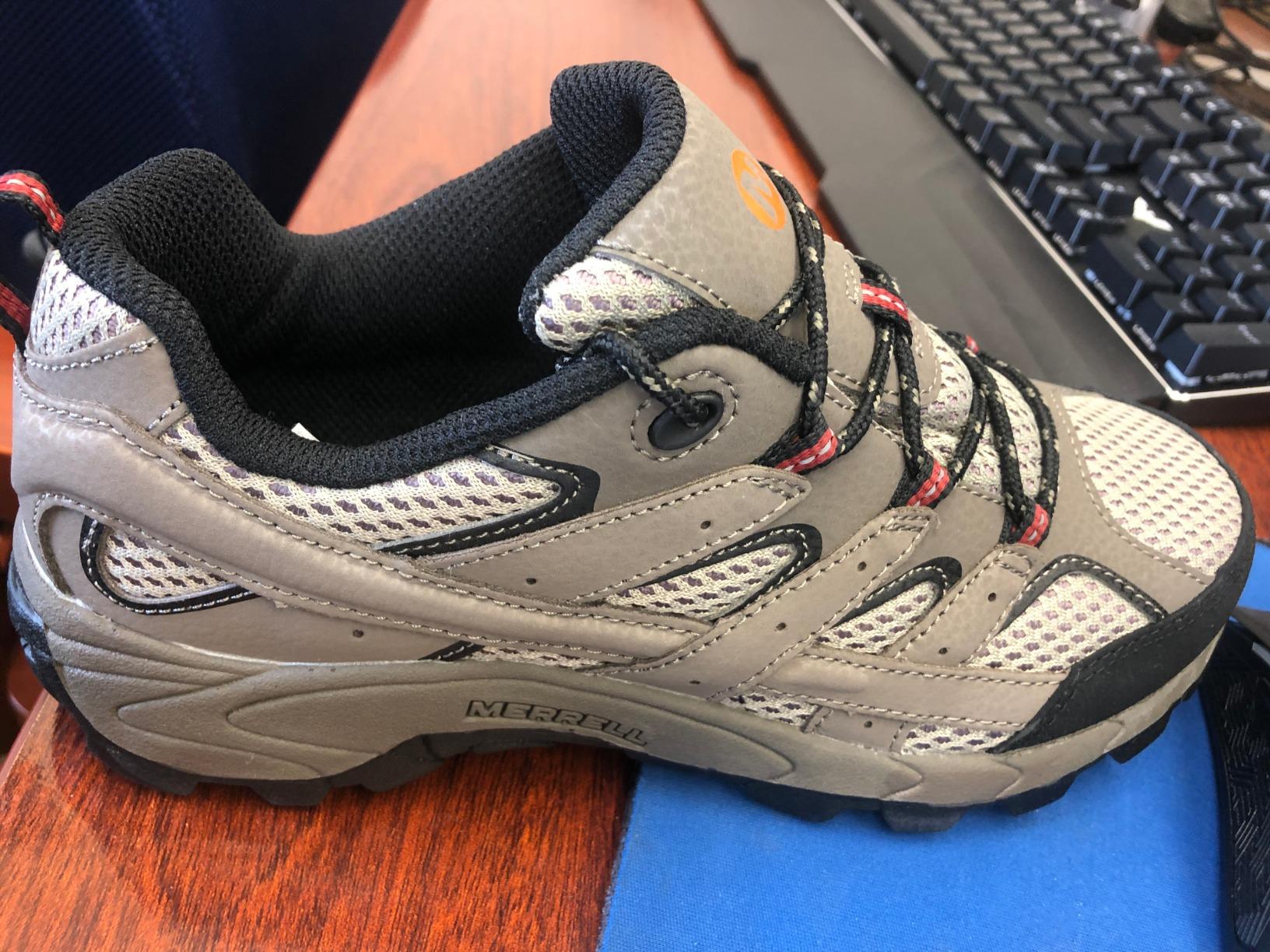 Close-up view of Merrell Kids Moab 2 showing mesh panels and suede construction details