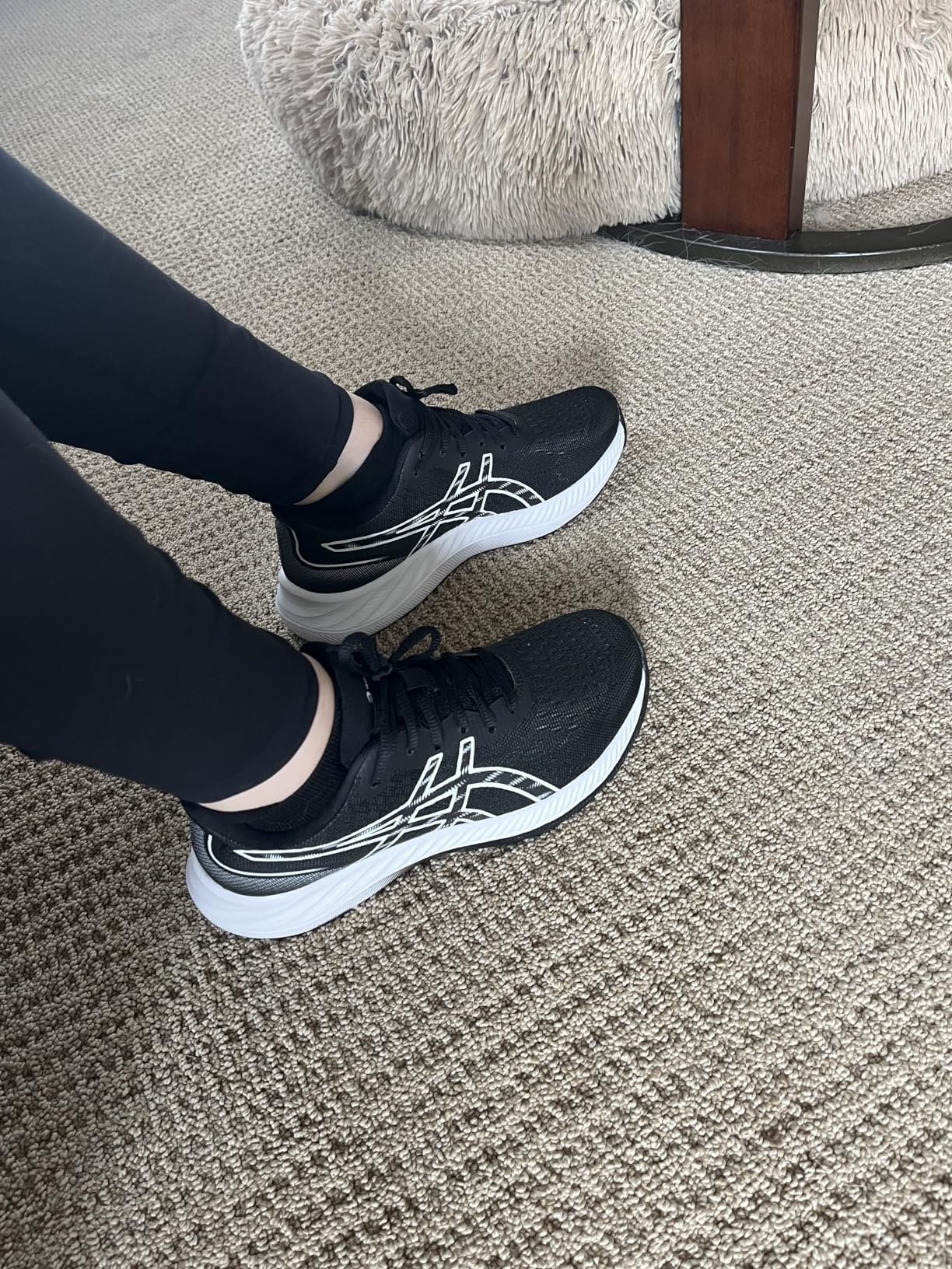 Side profile of ASICS Gel-Excite 9 showing midsole cushioning and overall silhouette